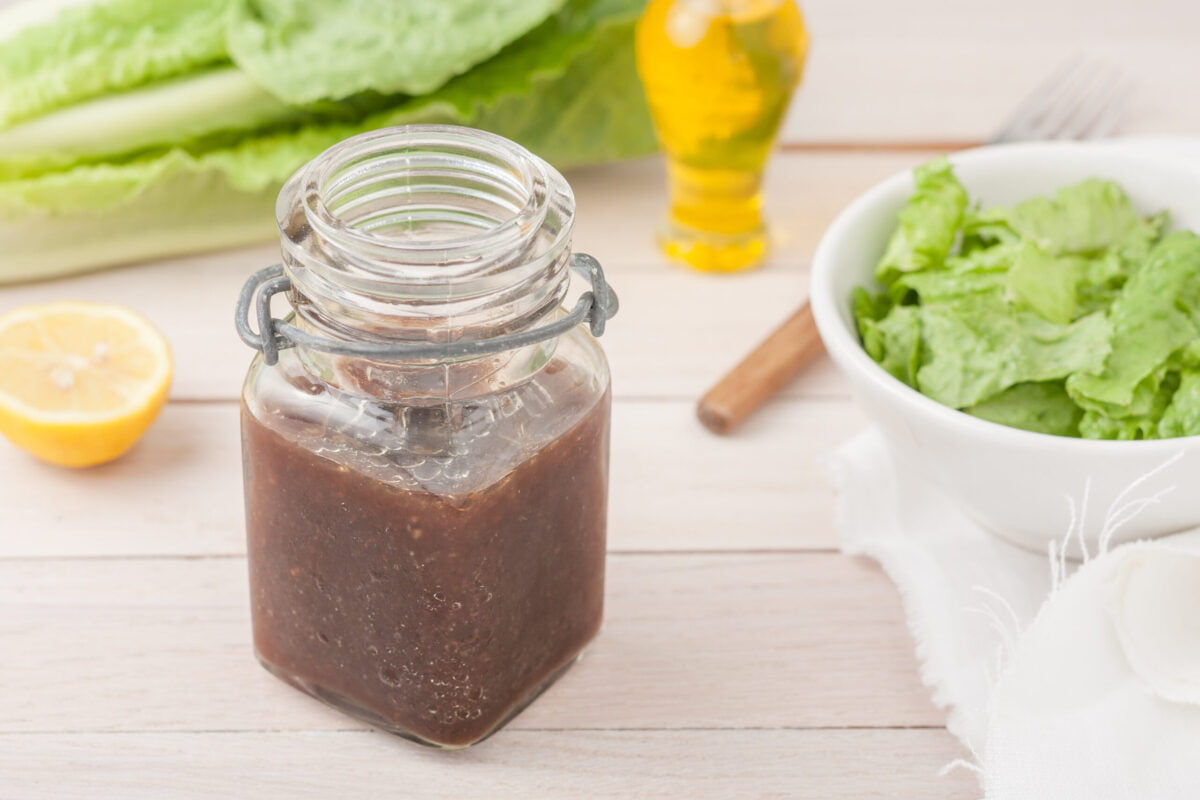 Fancy jar of balsamic vinaigrette on table