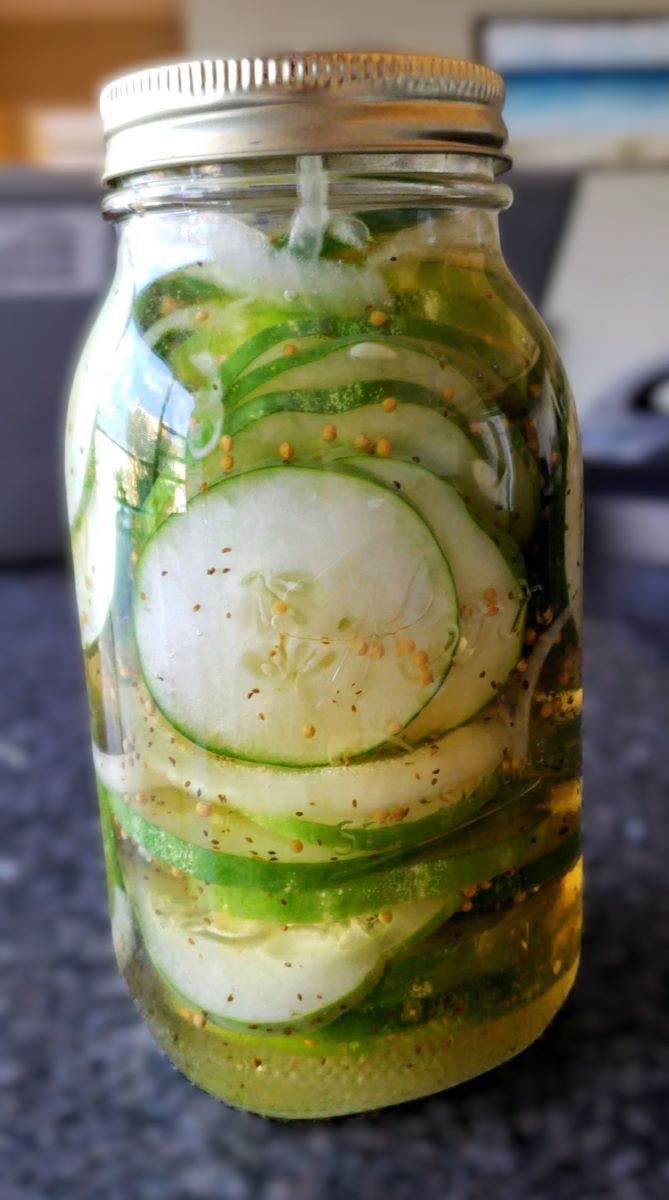 glass jar of pickles on counter