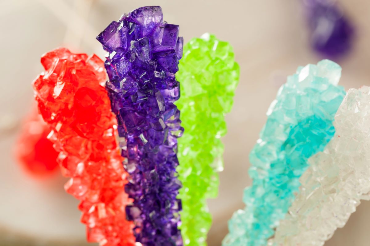 bright colored close up of rock candy on sticks