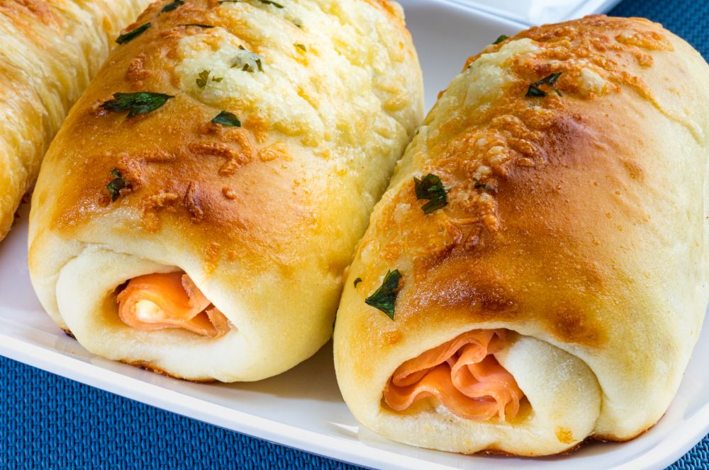 ham and cheese sticks on a white plate