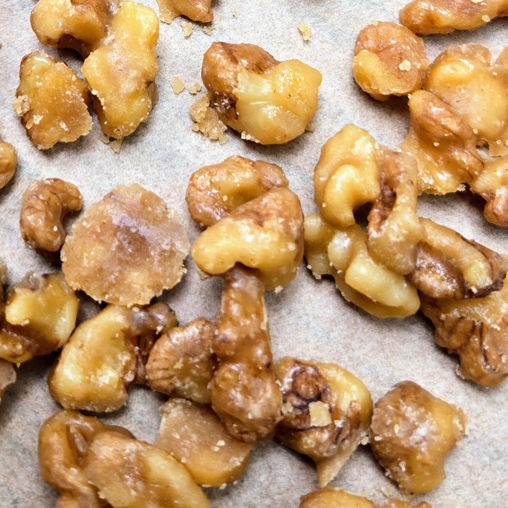 close up of candied walnuts cooling